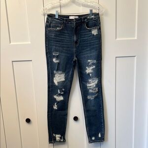Distressed ladies Blue Jeans by Vervet.